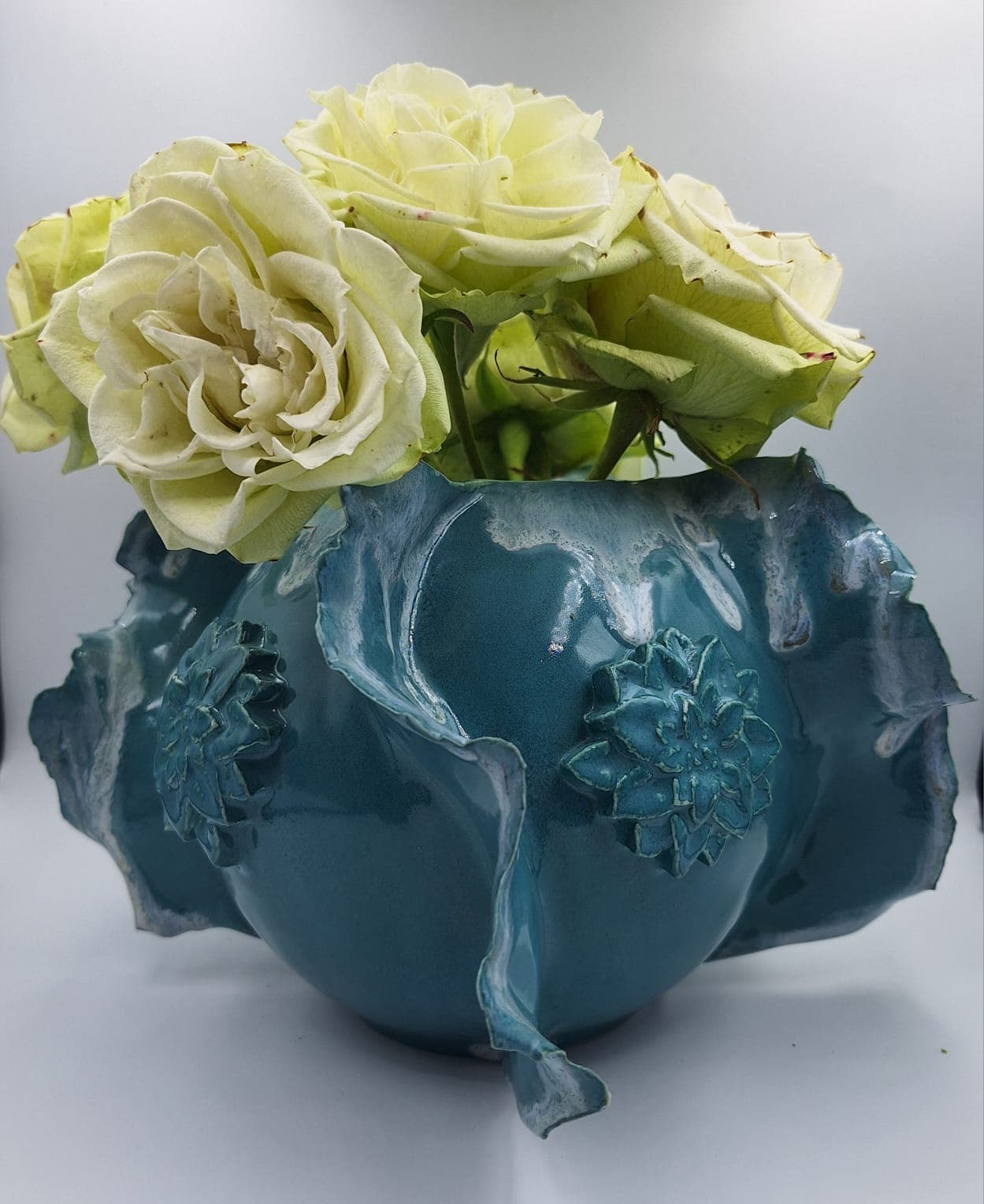 Artisan pottery bowl with a detailed botanical imprint
